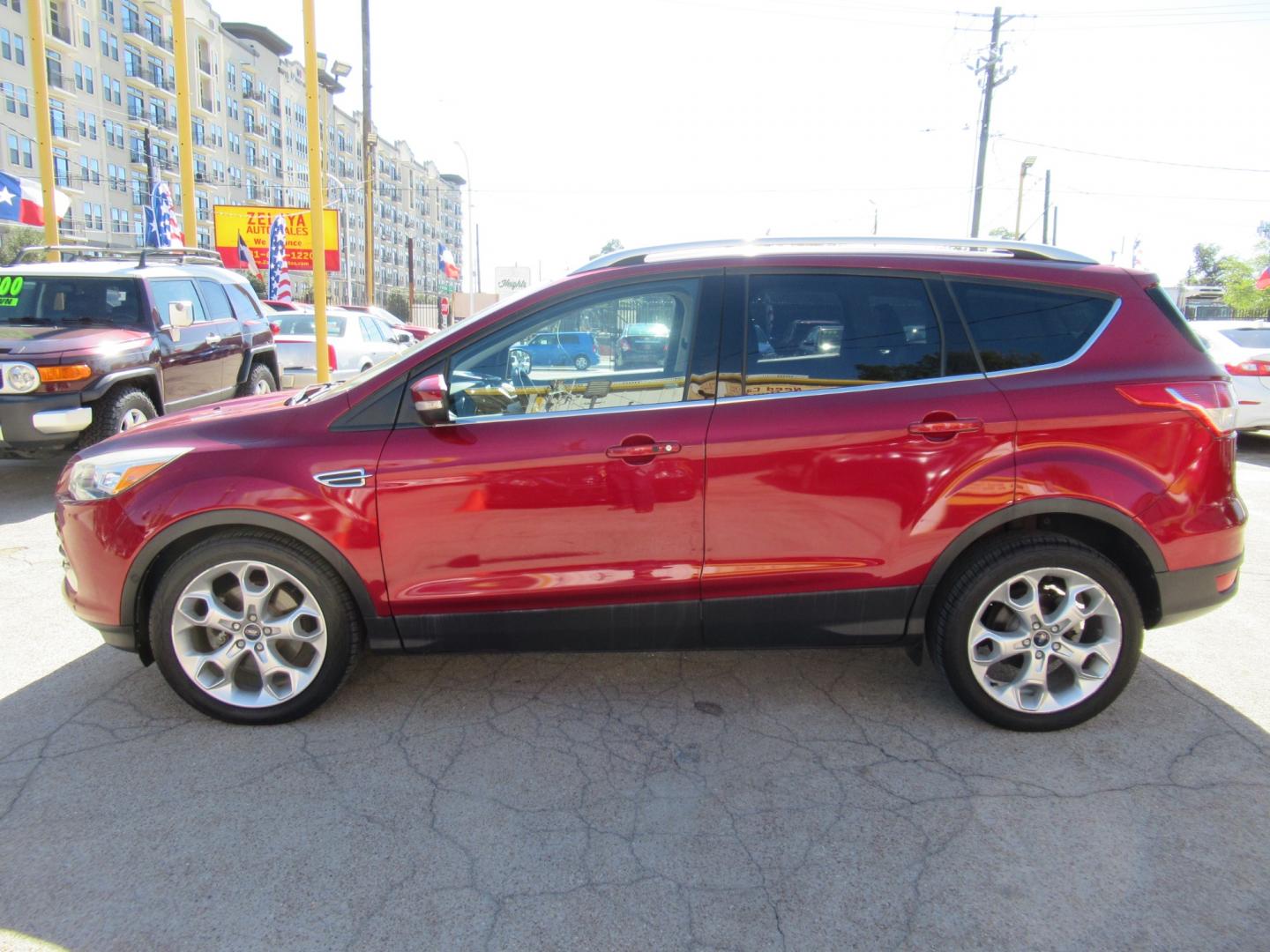 2014 Red /Black Ford Escape Titanium (1FMCU0J98EU) with an 2.0 engine, Automatic transmission, located at 1511 North Shepherd Dr., Houston, TX, 77008, (281) 657-1221, 29.798361, -95.412560 - 2014 FORD ESCAPE TITANIUM VIN: 1FMCU0J98EUA29272 1 F M C U 0 J 9 8 E U A 2 9 2 7 2 4 DOOR WAGON/SPORT UTILITY 2.0L I4 F DOHC 16V GASOLINE FRONT WHEEL DRIVE - Photo#0